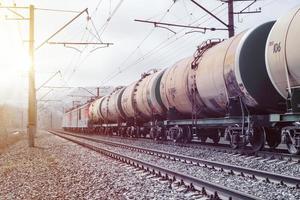 Freight train with tanks leaves into the distance. photo