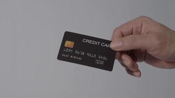 Man hand giving Credit card to woman hand. Isolated background. video