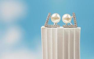 A beautiful Pearl Ear studs. Close-up of white pearl earrings. photo