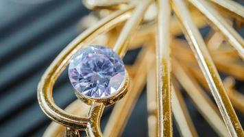 purple natural gemstone, Gems or gems on shiny gold photo