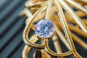 purple natural gemstone, Gems or gems on shiny gold photo
