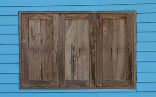 Old wood window blue wall photo