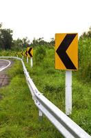 Signs left turn ahead. photo