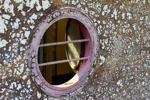 Peephole of wooden boats photo