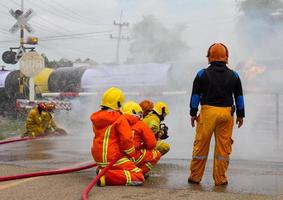 Firefighters extinguish oil train.