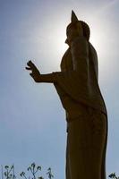 Silhouette standing Buddha. photo