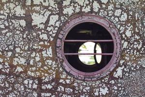 Peephole of wooden boats photo