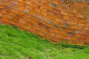 Curved brick wall grass photo