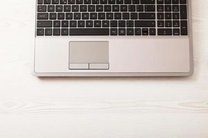 Creative workspace with work accessories and copy space on wooden table. Top view photo