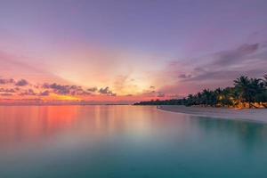 Beautiful tropical beach banner. White sand and coco palms travel tourism wide panorama concept. Amazing sunrise beach landscape, sky sunset clouds, relax nature tranquility, inspirational shore coast photo