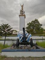 Sibolga, Indonesia January 14, 2022  A cannon with blue black and white stripes on display complete with wheels photo