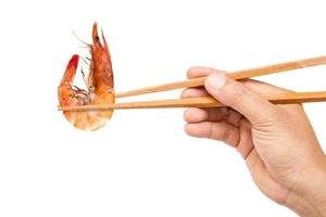 hand holding wooden chopsticks photo