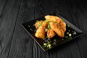 Chicken wings. Traditional asian recipe. Dark background. Copy space. Top view.
