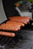 Grilled skewers of meat on the coals, with smoke. street food. photo