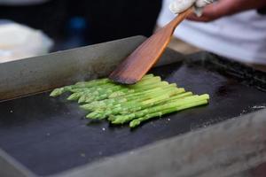 Roasted asparagus at a street food fist.