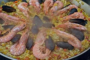 Spanish paella prepared in the street restaurant photo