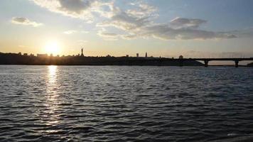 Dnieper River and two ducks floating on water in Kyiv in the sunset. Ukraine video