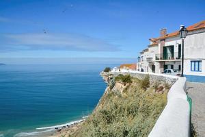 houses on a cliff with blue sky photo