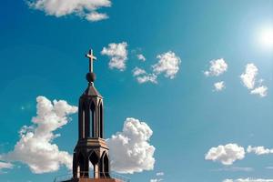 A large cross on a beautiful building photo