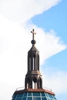 A large cross on a beautiful building photo