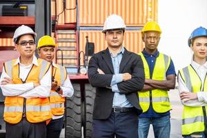 Group of professional businessman, Logistics engineer and inspector and businessman poundly for success business deal and project in shipping container commercial transport port background