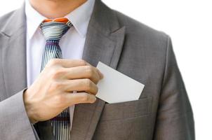 Business man handing a blank business card isolated on write background photo