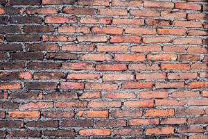 Old and dirty red brick wall background. Concrete line with brick line. photo