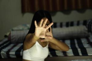 Woman raised her hand for dissuade, campaign stop violence against women , hand focus, vintage tone photo