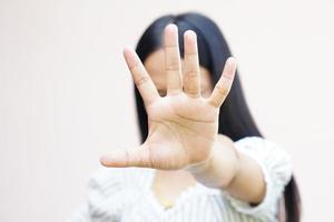 Woman raised her hand for dissuade, campaign stop violence against women photo