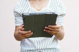 portable computer in the hands of a business woman photo