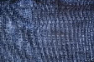 Dark blue textile background, indigo fabric cloth background. photo