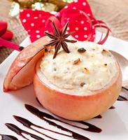 Baked apples with honey cream cheese, raisins and nuts photo