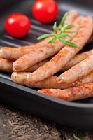 Tasty grilled sausages photo