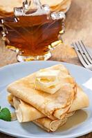 Pancakes with maple syrup photo