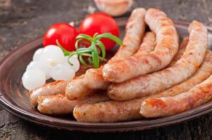 Tasty grilled sausages photo