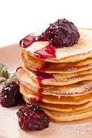 Delicious pancakes with strawberry jam