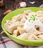 Meat Dumplings - russian boiled pelmeni in plate photo