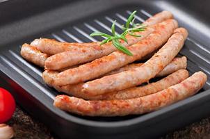 Tasty grilled sausages photo