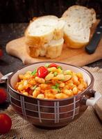 Boiled white beans with tomatoes and hot peppers photo