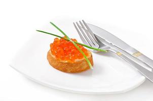 sandwich with red caviar in the form of a heart photo