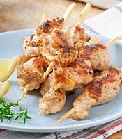 grilled chicken on bamboo skewers photo