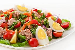 Salad with tuna, tomatoes, potato and onion photo