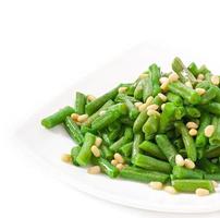 Fried green beans with cedar nuts photo