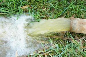 Water flows from the pipes into the fields. photo