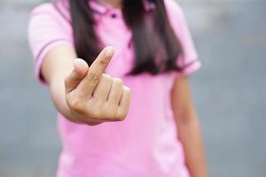 Asian woman's hand a small heart symbol photo