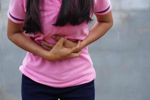 Woman suffer from stomachache Chronic gastritis Abdomen bloating concept photo