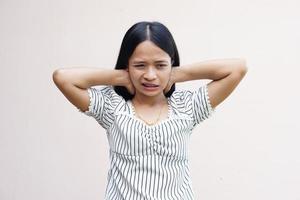 Asian woman has neck pain photo