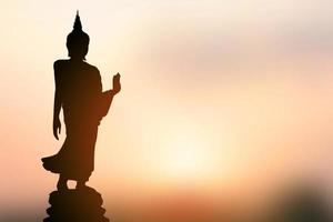 big buddha silhouette sunset background photo