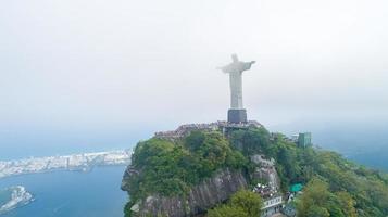 Rio de Janeiro, Rio de Janeiro, Brazil, Circa October 2019 Aerial view of Cristo Redentor, Christ the Redeemer Statue over Rio de Janeiro City, Brazil photo