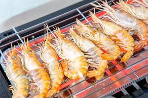 Cooking grilled shrimp with an electric grill. photo